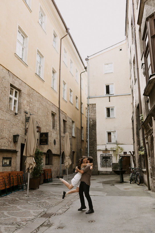 couple play in the streets of Innsbruck Austria
