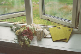 wedding day details on film a window seal with Norway beach in the background