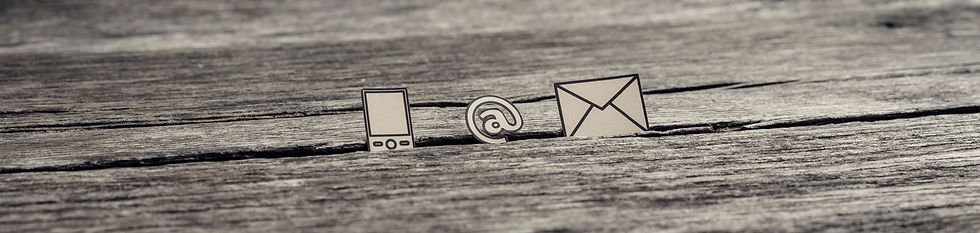 Image depicting symbols relating to communication on a wood panel background