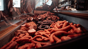 Refrigerator with a selection of meat from a butcher