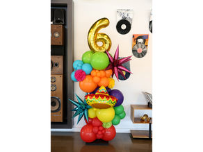 Organic balloon arch celebration stand for a birthday in Austin, TX 