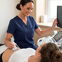 Sonographer performing an ultrasound scan on a female patient at MedHealth Ultrasound Southampton.