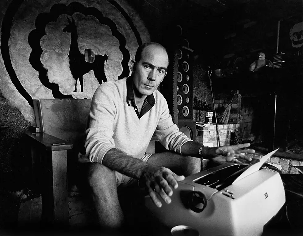 Hunter Thompson writing at his home base, Owl Farm.