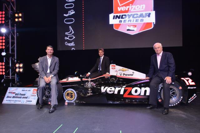 Will Power, Tim Cindric and Roger Penske with the championship car following the 2014 IndyCar Championship Celebration. Credit: Chris Owens