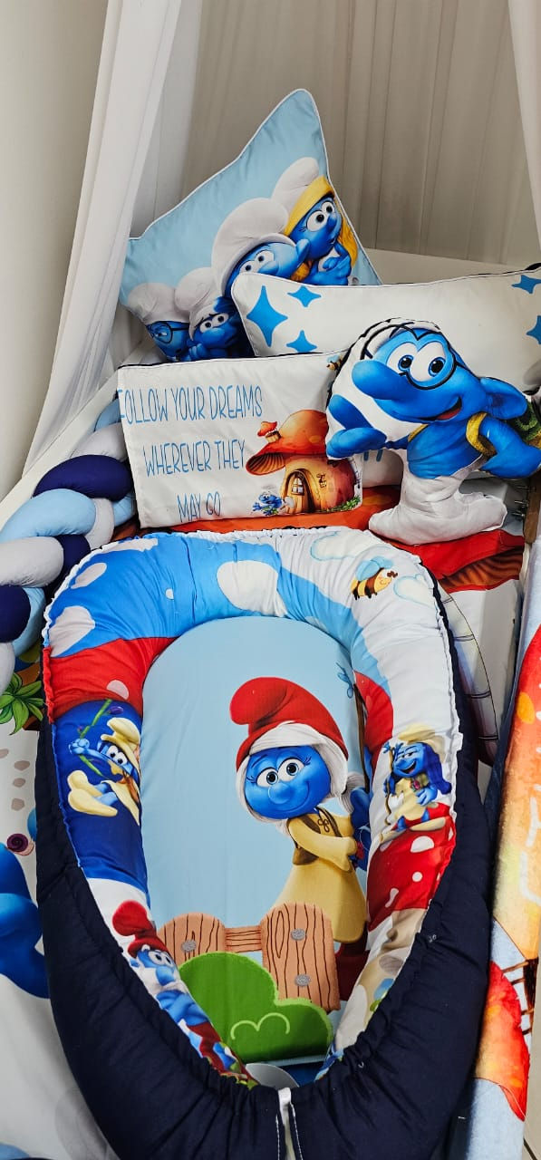 Thumbnail: Smurfy Blues - A playful nursery set featuring a charming cartoon-inspired design in vibrant blue tones. Perfect for adding a touch of fun and whimsy to your little one’s space. Crafted with high-quality materials for comfort and durability, this set is a lively addition to any nursery or a thoughtful gift for new parents.