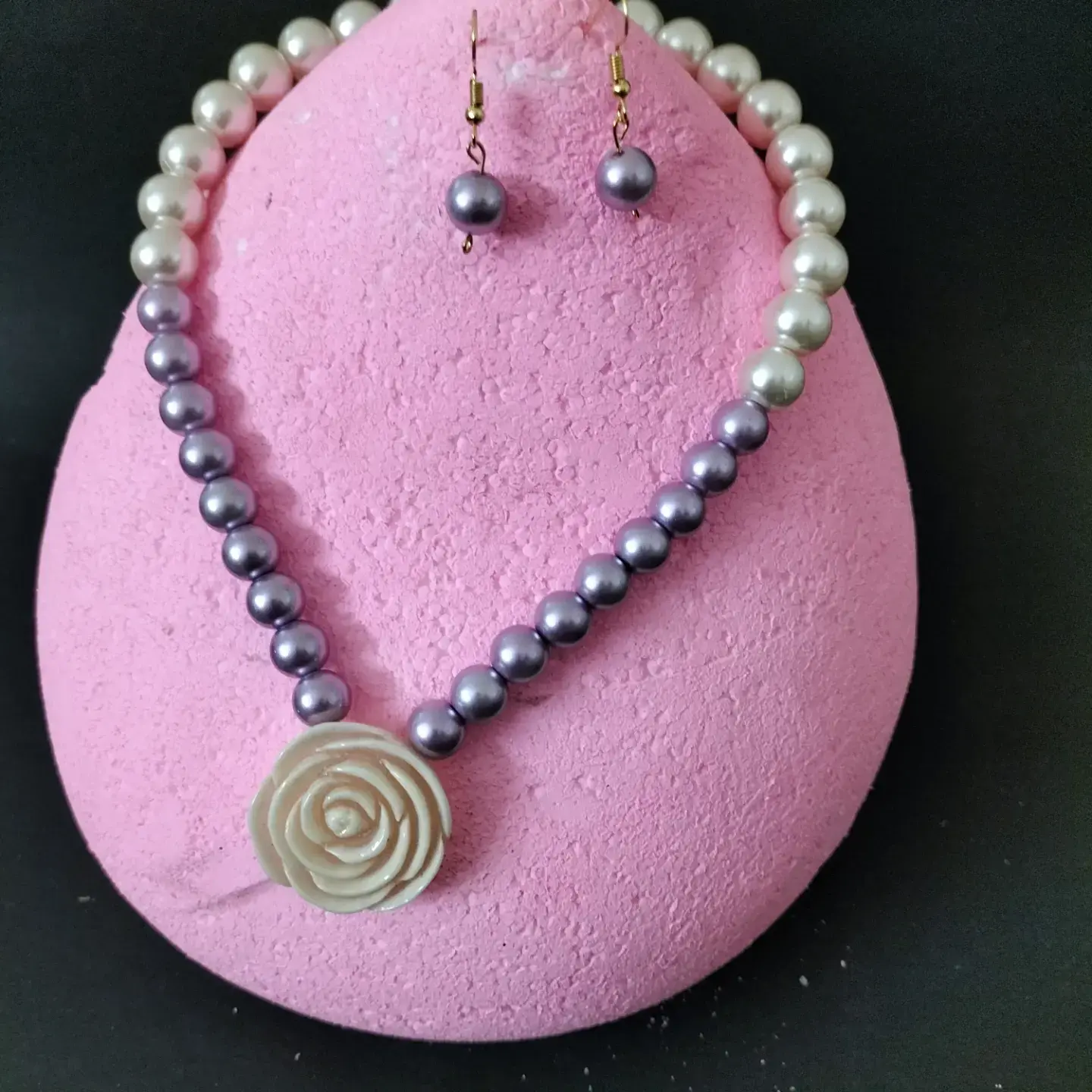 Pearl necklace set with pearl pendant.