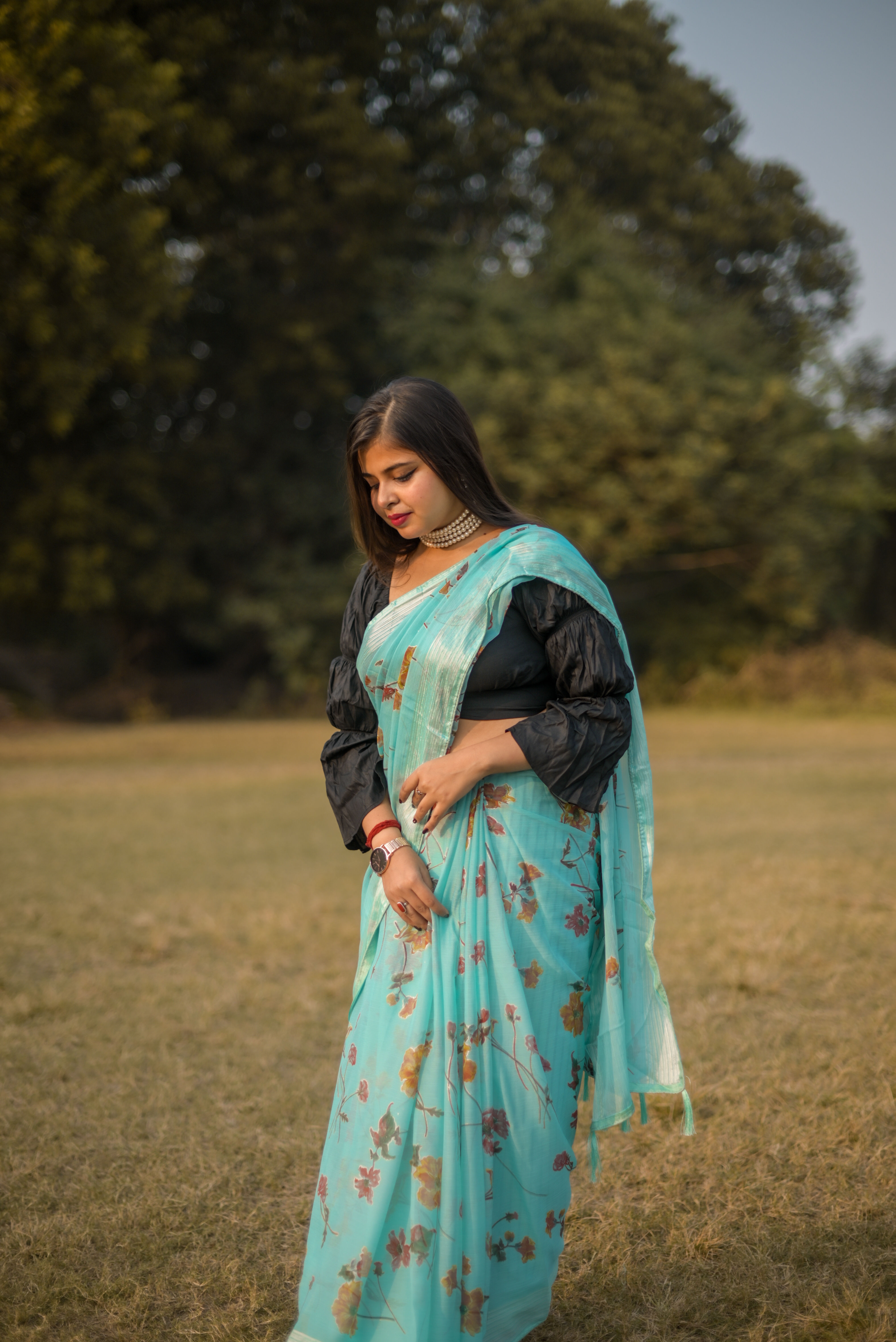Aqua-Blue Pronomi Chiffon Flowery Saree With Woven Border
