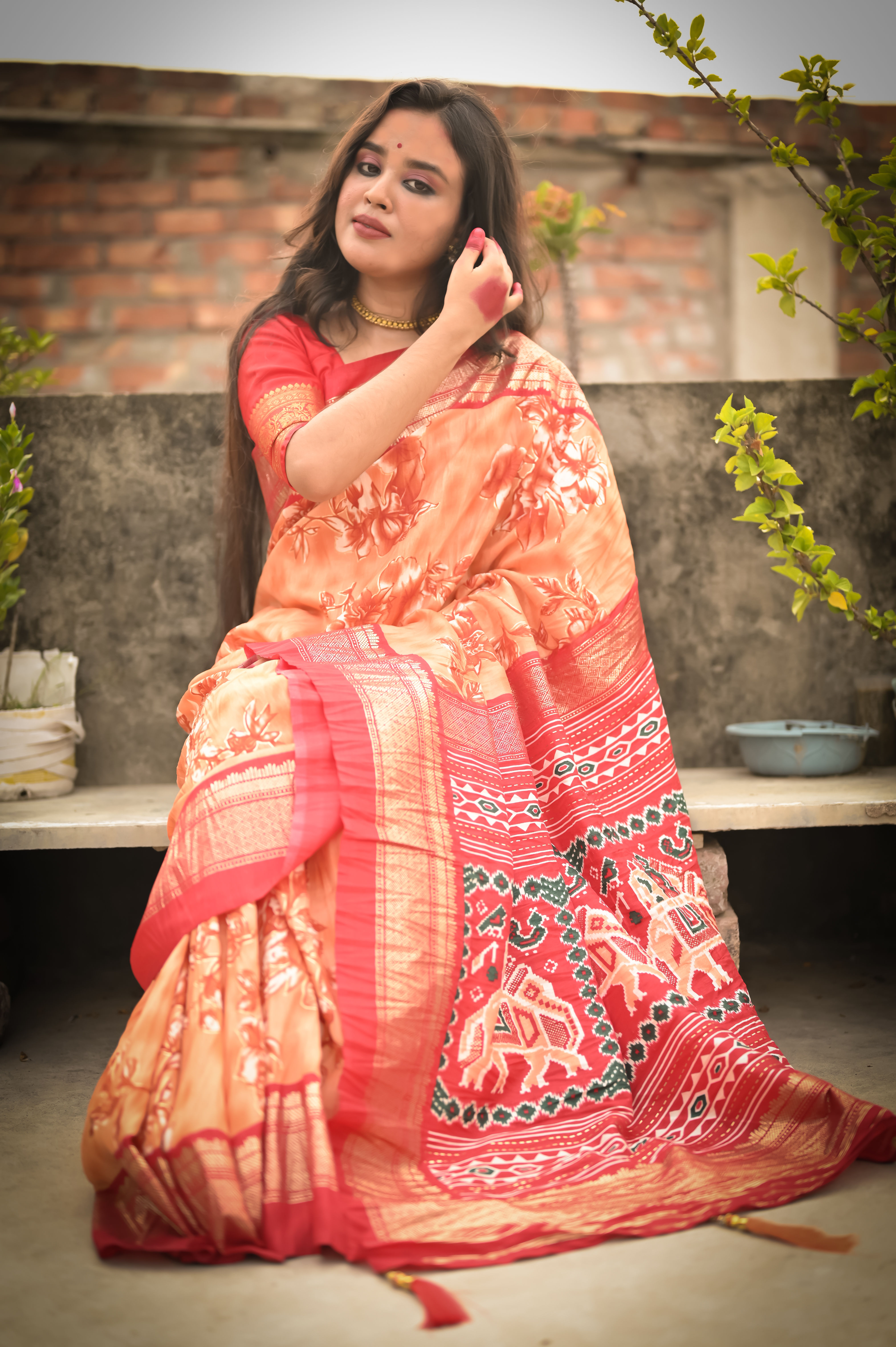 Light Orange Dola Silk Crush Saree With Flowery Pattern With Fancy Patola Pallu