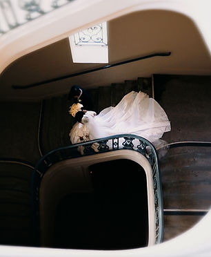 Bride and groom walking down the stairs in a creative top view shot
