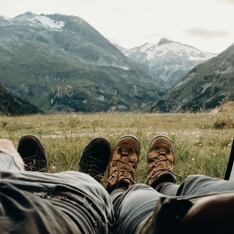 two people looking out a campsite
