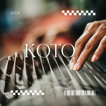 A Japanese stringed instrument called koto, with a long wooden body, strings stretched over movable bridges, and played using plucking techniques.