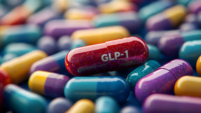 Medical capsules and GLP-1 pills highlighting the rising demand for GLP-1s covered in employer's health plans.