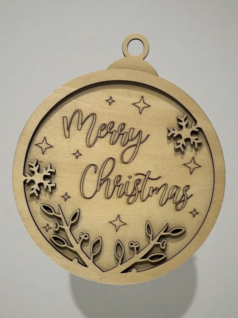 Thumbnail: Individual oversized layered wood Christmas ornaments with engraved holiday scenes
