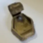 Thumbnail: Action photo of copper dice thrower releasing dice through the chute during gameplay.