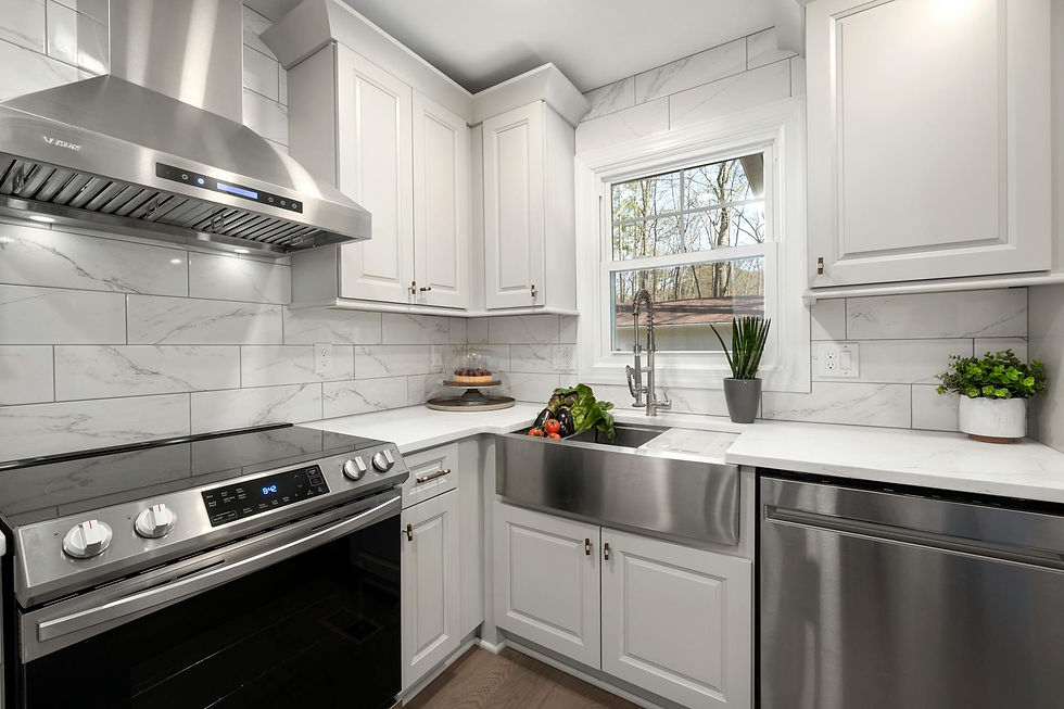 Eye-level view of a modern kitchen with marble countertops and natural light