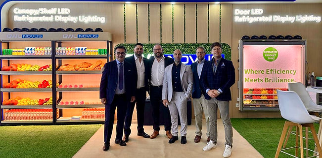GWL Novus team in front of LED high performance displays