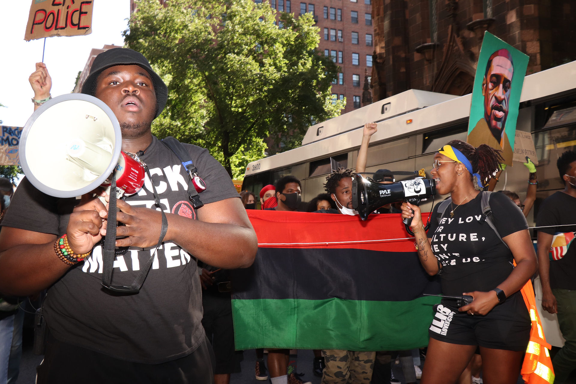 Regine Shabazz (right) and another protest leader lead a march through Hell’s Kitchen