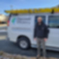 Cameron owner of Discover Efficiency standing in front of his work van