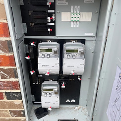 Clipsal electrical box on a concrete slab at a construction site.
