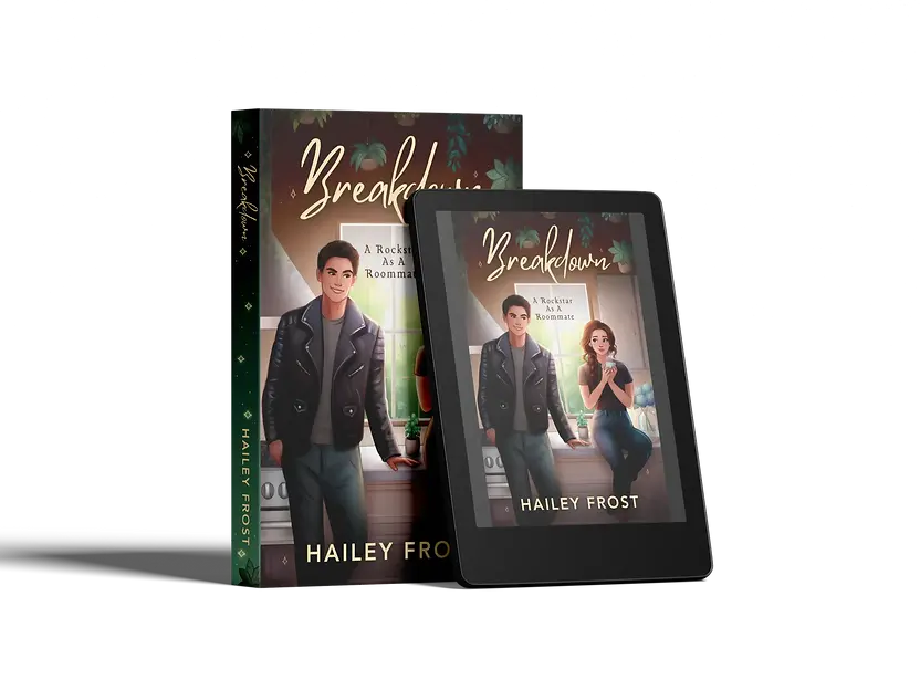 Paperback Mockup / Cover of roommate romance book by Hailey Frost. Depicts the title, “Breakdown” and subtitle, “A Rockstar As A Roommate”. The image depicts a kitchen, with a green vibe and plants. She’s sitting on the kitchen counter, a bright window at her back, while the rockstar leans against the counter next to her. She glances at him over her coffee and he grins at her.