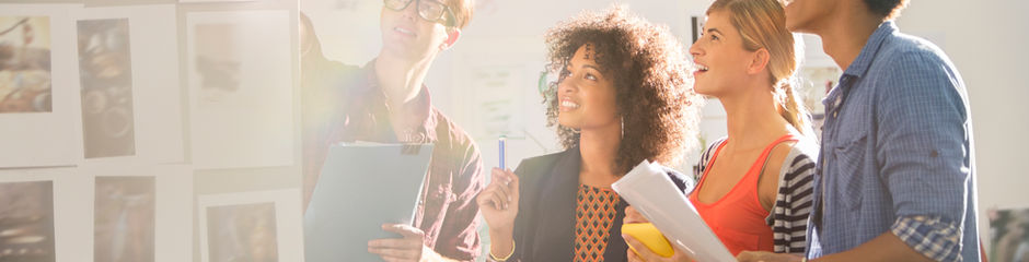 Group of people at a whiteboard sharing ideas