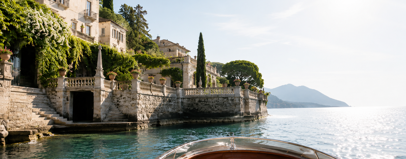 Luxury lakeside villa viewed from a private boat for personalised travel planning