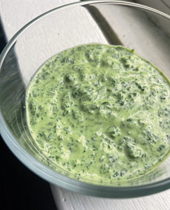 parsley garlic sauce in a bowl on a windowsill