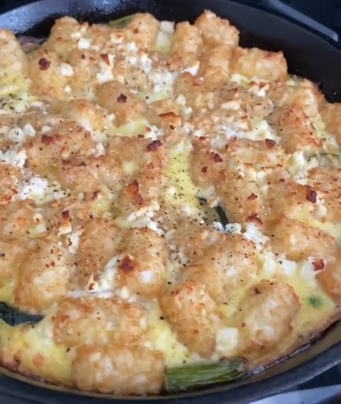 A tater tot frittata hot from the oven