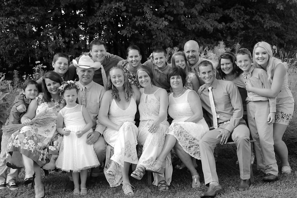Tanya Larson is a Social Worker and Managing Director at Midwest Care Management Services. Pictured here with her parents, siblings, and the grandchildren.