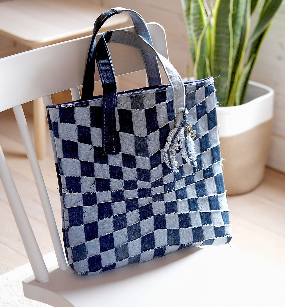 Thumbnail: a denim tote bag made from upcycled jeans on a white wooden chair