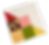 Colorful patchwork quilt square with floral and patterned fabric pieces on a black background