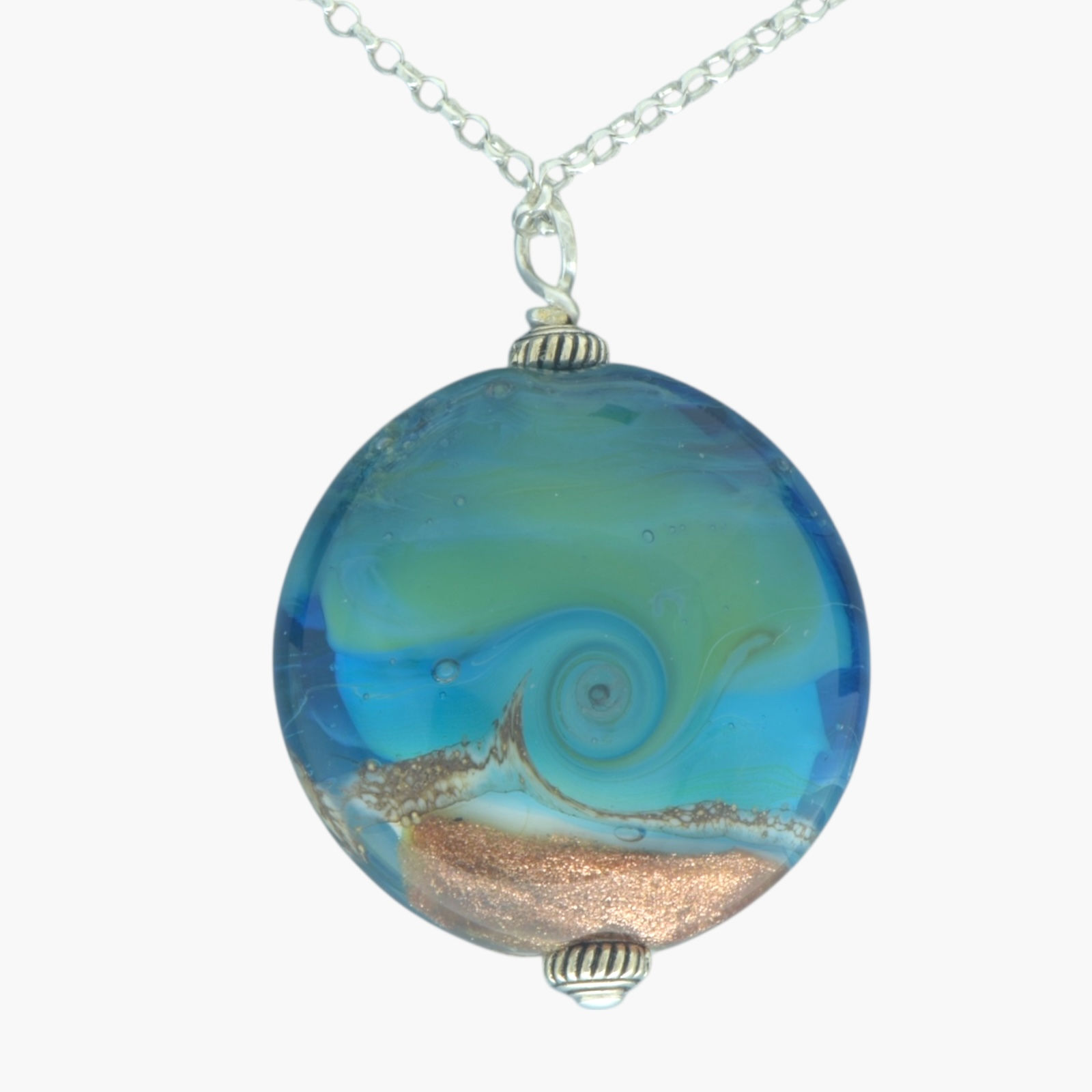 Blue sea and golden sand glass pendant on a silver chain