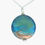 Thumbnail: Blue sea and golden sand glass pendant on a silver chain