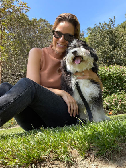 Woman hugging happy dog