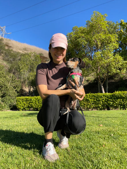 Woman holding small dog