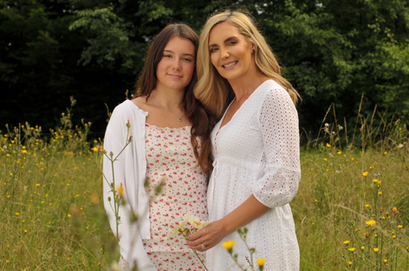Mother and daughter family portrait photography in wild flowers