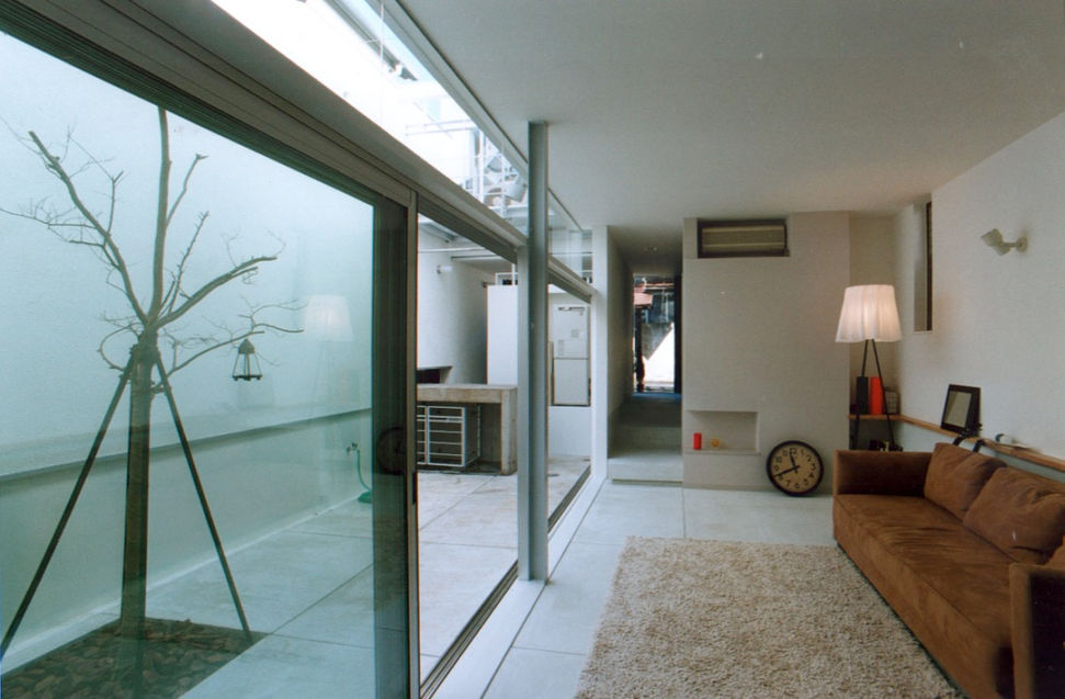 Large windows that can be fully retractable. Living room integrated with light garden.