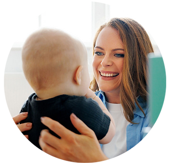 Sarah Murray holding a baby