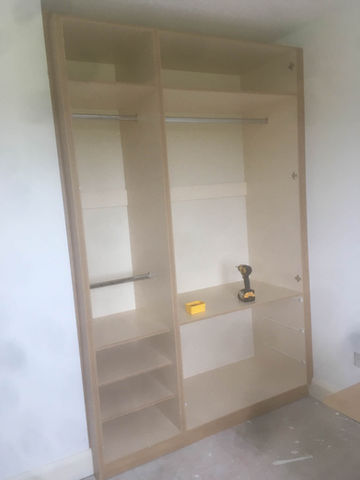 Custom built-in wardrobe, light wood finish