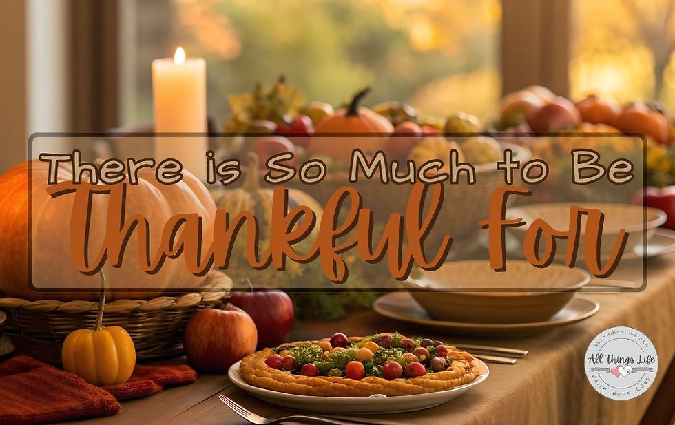 A beautifully arranged Thanksgiving table sits in warm, golden light. Pumpkins, apples, grapes, and fall greenery fill the center of the table, while a glowing candle adds a peaceful ambience. A fresh autumn tart and neatly set dinner plates extend across the table, creating a cozy and inviting holiday scene. Over the image, the phrase “There is So Much to Be Thankful For” is displayed in warm, rustic lettering, matching the soft, seasonal atmosphere.