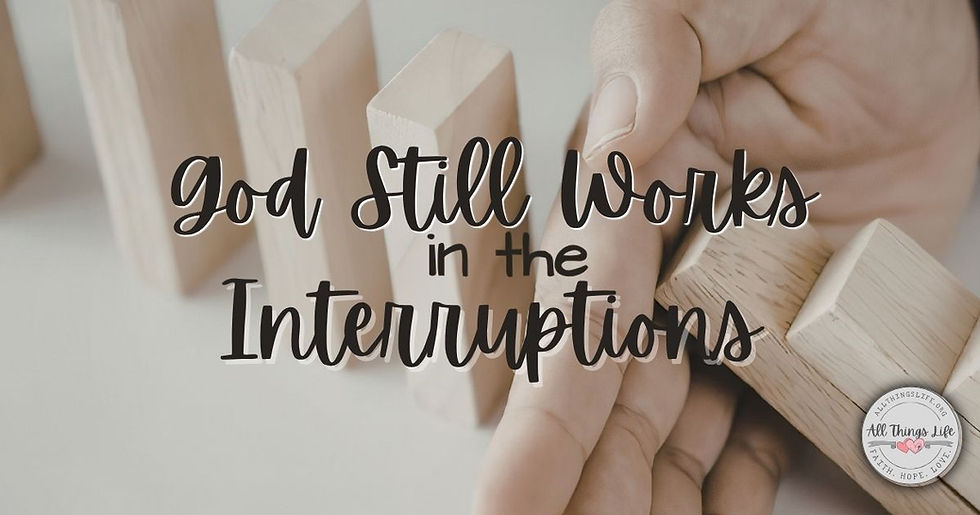 Hand stopping a row of falling wooden dominoes with the words "God Still Works in the Interruptions" overlaid on the image, symbolizing God's sovereignty and faithfulness during unexpected changes and life interruptions.