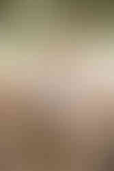 couple standing outside courthouse, posing together after eloping