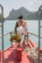 bride and groom on boat at their Ang Thong Wedding