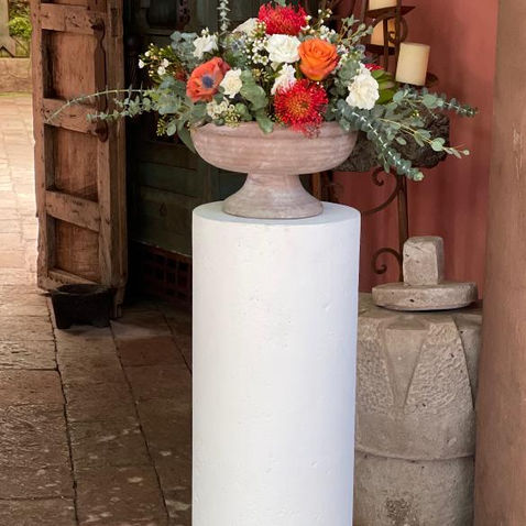 Colorful flower arrangement in a vase for a ceremony decoration.