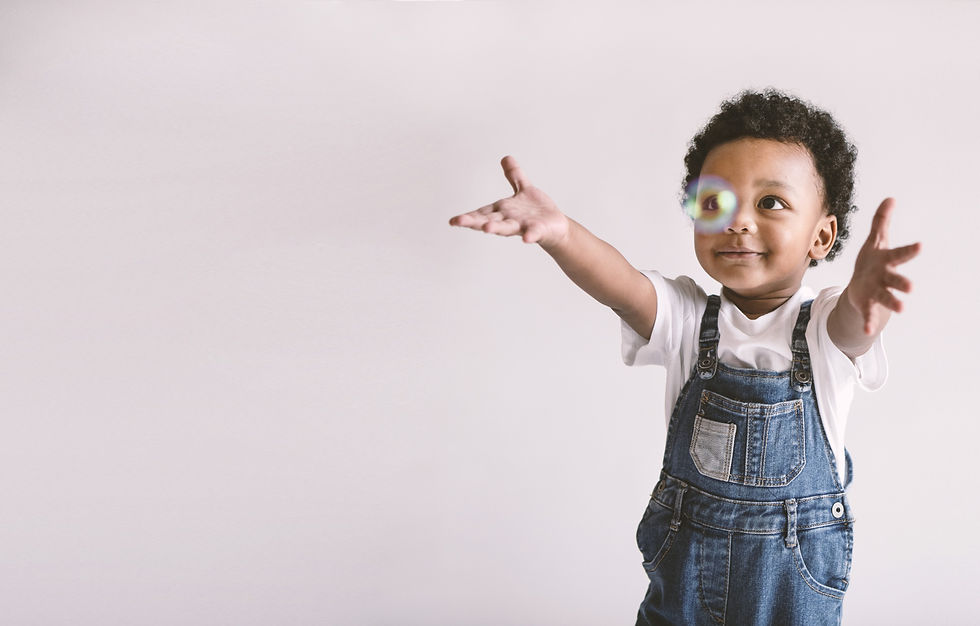 Child playing with soap bubbles, website design example by Arian Tokuda.