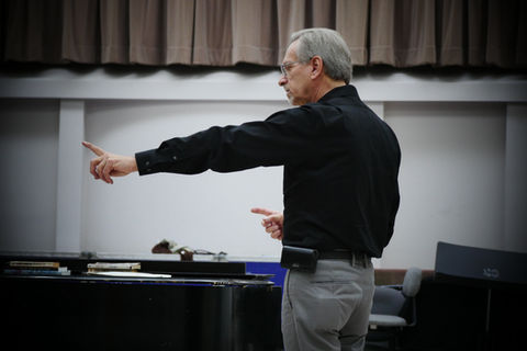 OperaWorks conductor coaching singer during rehearsal session