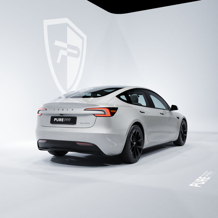 Rear angle view of a Tesla Model 3 wrapped in PurePPF Sterling Silver, showing the bright and polished silver finish with metallic sparkle.