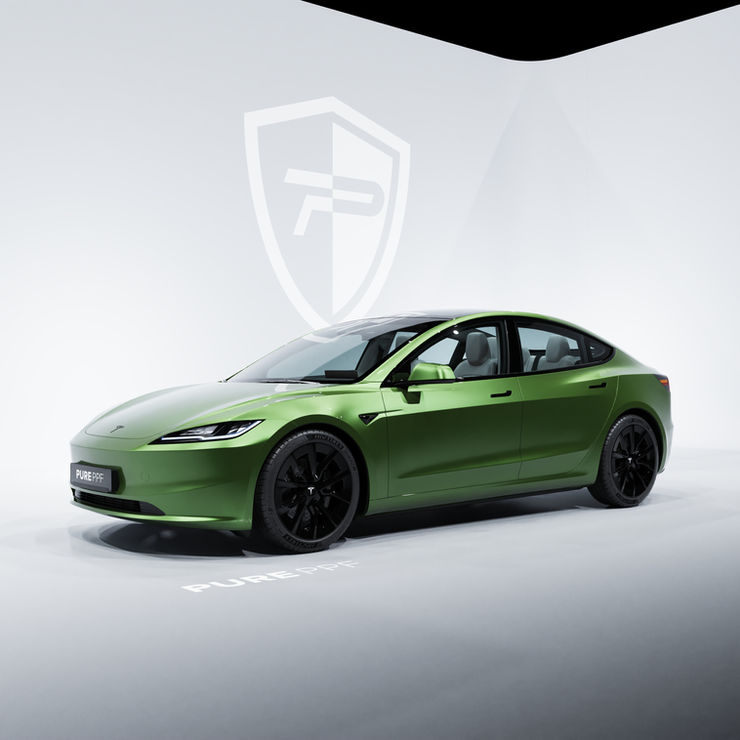 Side view of a Tesla Model 3 wrapped in PurePPF Hulk Green, highlighting the powerful and striking appearance of the vibrant green color.