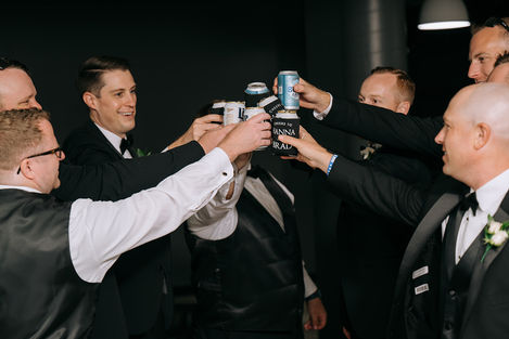 The Maverick Group toasting with drinks in formal attire.