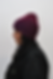 Knitted beanie crafted from repurposed luxury materials, showcasing sustainable fashion design.